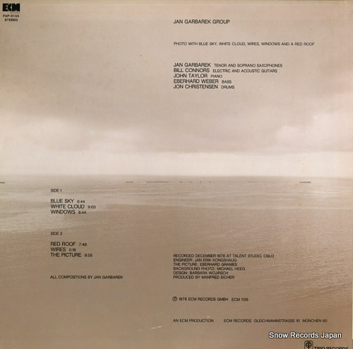 GARBAREK, JAN phoo with blue sky, white cloud, wires, windows and a red roof PAP-9155