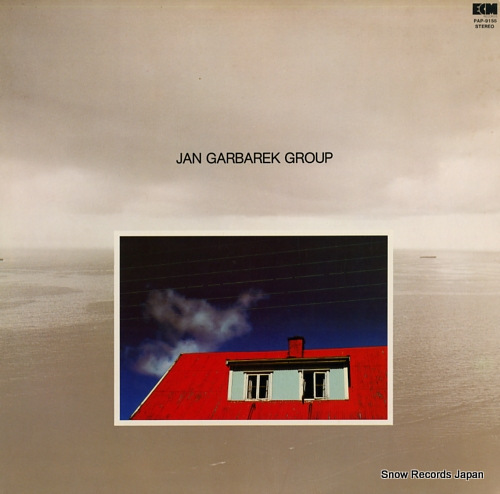GARBAREK, JAN phoo with blue sky, white cloud, wires, windows and a red roof PAP-9155